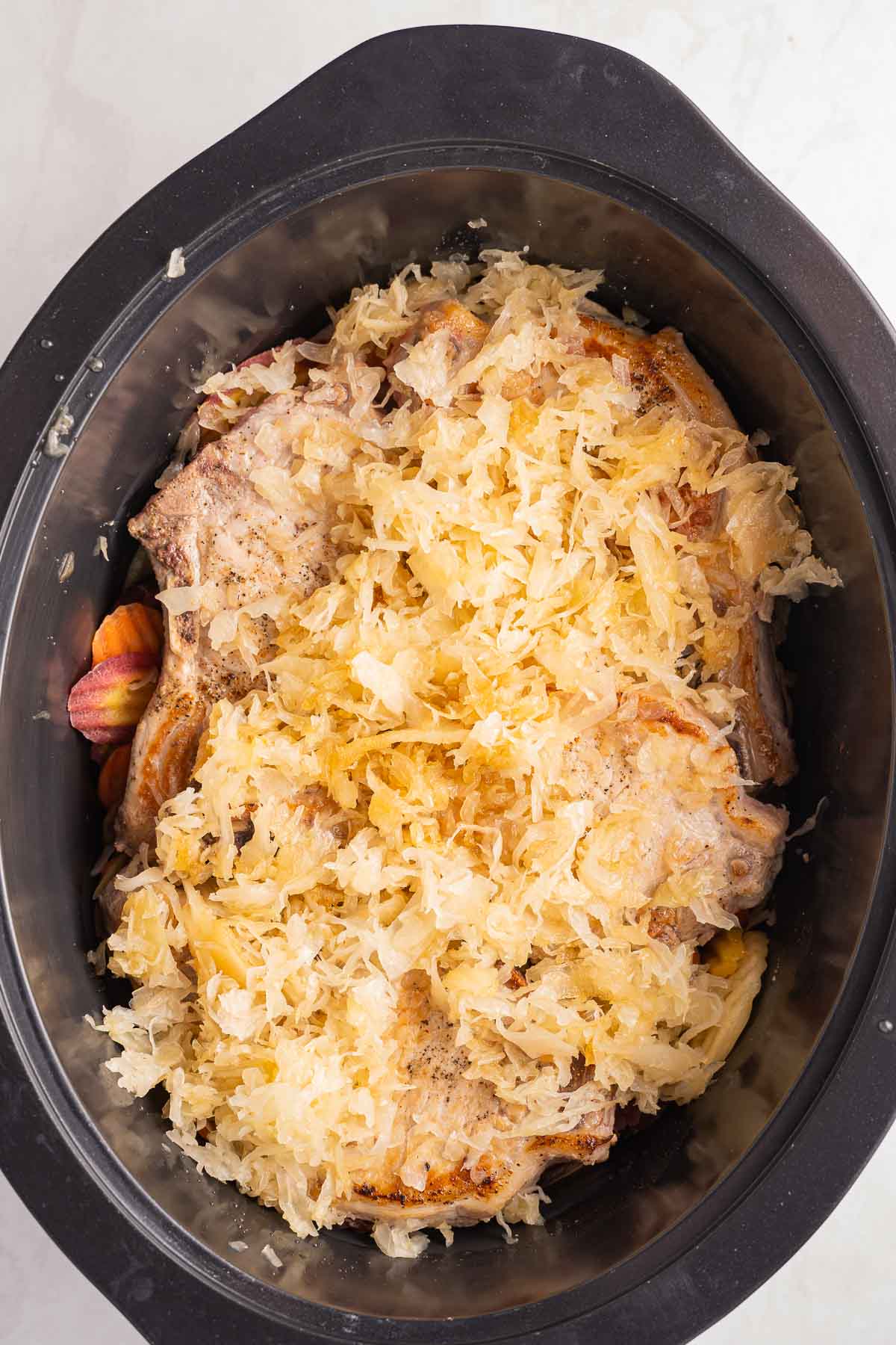 Delicious Crock Pot Pork Chops with Sauerkraut - Easy Slow Cooker Recipe